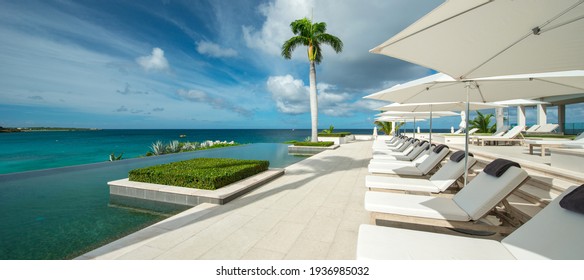 Anguilla Island, Anguilla British West Indies - December 3, 2015 Four Season Resort Pools And Gardens Over A Cliffs With Barnes Bay View. 