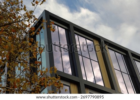 Angular top of building with a cloudy sky