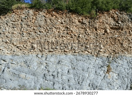 Angular unconformity between Eocene marine lutites and Pleistocene continental conglomerates, sandstones and shales (Boltaña, Huesca, Spain).