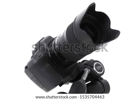 Angular view of camera glass of new black camera isolated