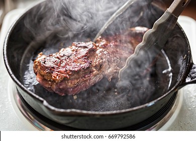 Angus steak fried on vegetable oil on iron cast  - Powered by Shutterstock