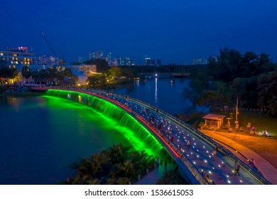 Anh Sao Or Starlight Bridge Is A Pedestrian Bridge With A Waterfall And Beautiful Colored Lighting On The Saigon River. It Is A Major Tourist Attraction In District 7 Of Ho Chi Minh City In Vietnam