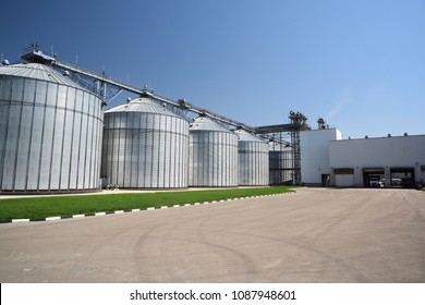 Animal Feed Factory. Big Modern Granary In Sunny Summer Day. Metal Containers For Grain