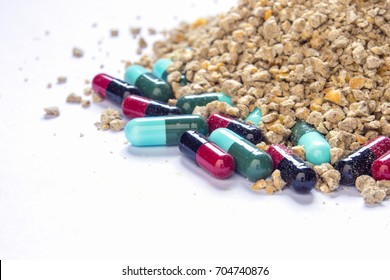 Animal Feed And Many Pill Capsules, Antibiotics In Livestock Feed Concept.