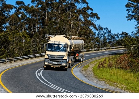 Animal feed truck and trailer climbing Garcia's Pass near Riversdale in the Western Cape, South Africa