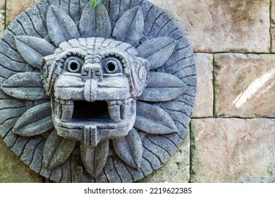 Animal Head Made Of Stone On The Wall In The Style Of South American Indians. Imitation Of History