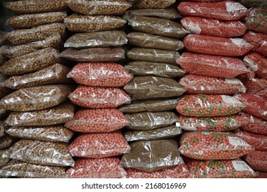 animal market, red colorful farm animal feed pellets. bird and fish feed in packaged form
