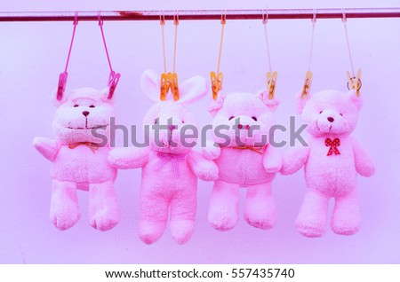 Animal pink doll friends on clothes line in soft sweet vintage tone 