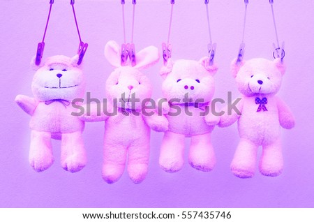 Animal pink doll friends on clothes line in soft sweet vintage tone 