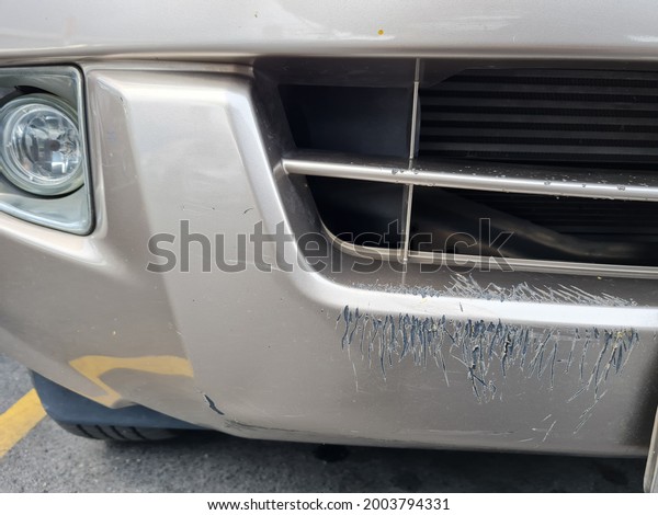 Animal scratch in front of bumper car. Bumper car\
got damage from dog\
bited.