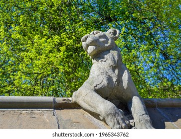 An animal sculpture at Cardiff city centre in a sunny day with green tree background.  