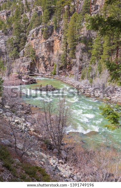 The Animas River is found in the San Juan National\
Forest in Colorado. You cannot get here by car so need to hike in\
or take a train that runs through the natural beauty. Steep cliffs\
surround the riv
