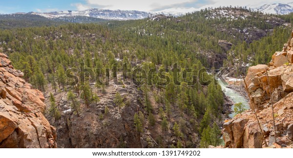 The Animas River is found in the San Juan National\
Forest in Colorado. You cannot get here by car so need to hike in\
or take a train that runs through the natural beauty. Steep cliffs\
surround the riv