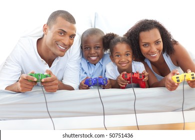 Animated family playing video game lying down on bed at home