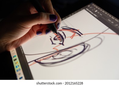 Animator designer drawing sketching development creating graphic pose characters, animation design studio. Caserta, Italy, July 22th 2021.