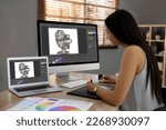 Animator working with graphic tablet, computer and laptop. Illustrations on screens