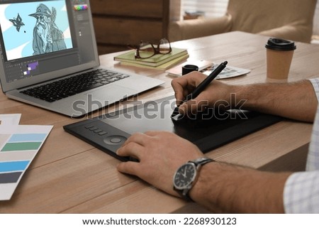 Animator working with graphic tablet and laptop, closeup. Illustration on screen