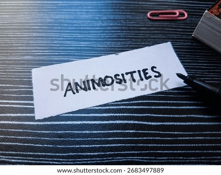Animosities writting on table background.