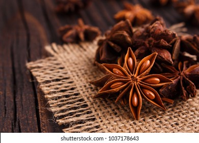 anise stars on a dark rustic background - Shutterstock ID 1037178643