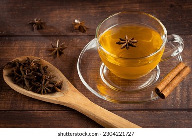 Anise tea with cinnamon in glass cup.