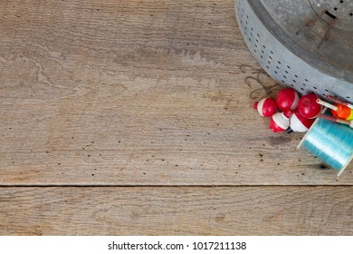 Anitque Minnow Bucket With Old Red & White Bobbers, Hooks & Fishing Line On Barn Wood With Copy Space