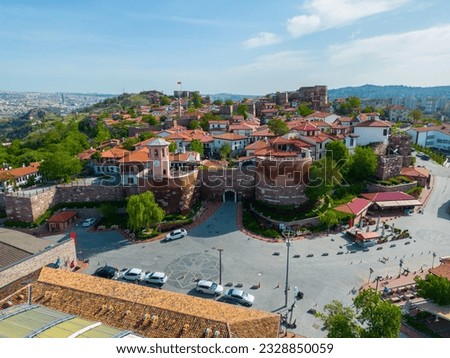 Ankara Castle (Turkish: Ankara Kalesi) Main Gate with tower and historic residential buildings aerial view. The castle is an historic fortification in Altindag district in city of Ankara, Turkey. 