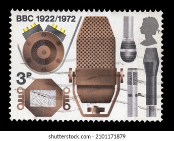 Ankara, Turkey - 01,05,2022: An England postage stamp shows celebrating the 50th Anniversary of the BBC showing Microphones. Circa 1972