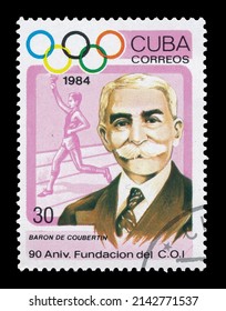 Ankara, Turkey - 04,05,2022: A Cuba postage stamp shows 90th Anniversary of IOC. Baron Pierre de Coubertin from series Summer Olympics Atlanta, circa 1984
