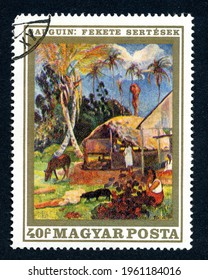 Ankara, Turkey - 23 April 2021: A Hungary postage stamp shows the painting "black pigs", by Paul Gauguin, the famous french post-impressionist artist. Circa 1970...