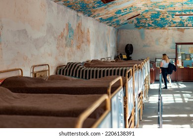 Ankara, Turkey-September 23, 2022: A Woman Visitor Looking At Bunks In Prison Dormitory In Ulucanlar Prison Museum. Ulucanlar Historical Prison Was Established In 1925 And Converted To Museum In 2011.