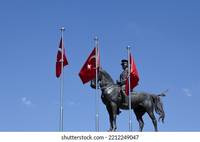 Ankara,Turkey - September 23, 2022; Statue Of Mustafa Kemal Atatürk, The Founder Of The Turkish Republic, On A Horse, In Ankara.Foreground Flags Of The Republic Of Turkey.