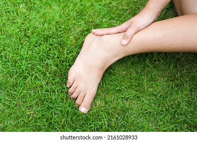 Ankle Pain. Young Woman Suffering From Ankle Pain.