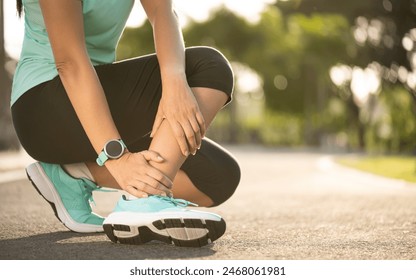 Ankle sprained. Young woman suffering from an ankle injury while exercising and running. Healthcare and sport concept. - Powered by Shutterstock