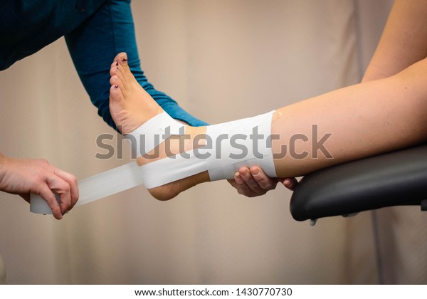 Ankle tape job for\
stability and support