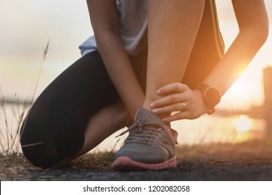 Ankle Twist Sprain Accident In Sport Exercise Running Jogging.sprain Or Cramp Overtrained Injured Person When Training Exercising Or Running Outdoors.