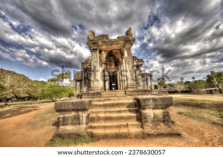 Ankor Wat is filled with hundreds of temples. Some of them are easy to find like this one. Others are hidden and meant for the tomb raiders of the world. Vines crawling over ancient stone temples. 