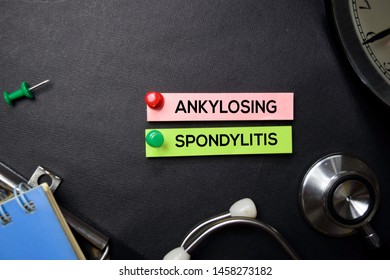 Ankylosing Spondylitis text on Sticky Notes. Top view isolated on black background. Healthcare/Medical concept
