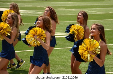 ANN ARBOR, MI - AUGUST 10:  University of Michigan Dance Team members perform at the Michigan Football Youth Day on August 10, 2014 in Ann Arbor, MI.