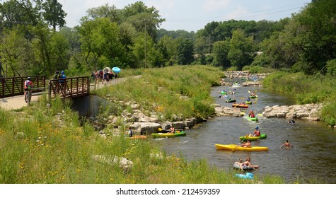 ANN ARBOR, MI - AUGUST 3: Kayakers enjoy the rapids at the Argo Cascades in Ann Arbor, MI on August 3, 2014.