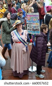ANN ARBOR, MI - JAN 21:  A protester dressed as a suffragette demonstrates at the Women's March in Ann Arbor on January 21, 2017. 