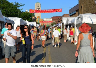 ANN ARBOR, MI - JULY 20: Crowds enjoy the Ann Arbor State Street Area Art Fair in Ann Arbor, MI. With 325 artists, it is one of four art fairs taking place in Ann Arbor July 20, 2011.