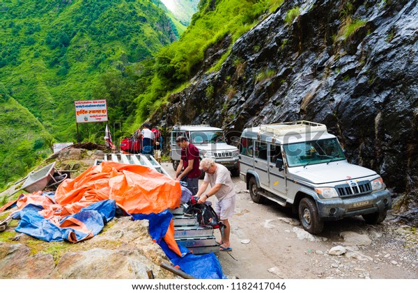 Annapurna Conservation Area, Nepal - July 18, 2018\
: Off road vehicles with tourists in Annapurna Conservation Area, a\
hotspot destination for mountaineers and Nepal\'s largest protected\
area.