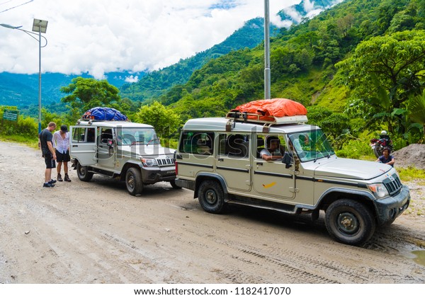 Annapurna Conservation Area, Nepal - July 18, 2018\
: Off road vehicles with tourists in Annapurna Conservation Area, a\
hotspot destination for mountaineers and Nepal\'s largest protected\
area.