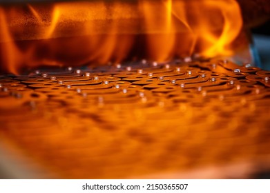 Annealing powdered details with burning flame in furnace - Powered by Shutterstock