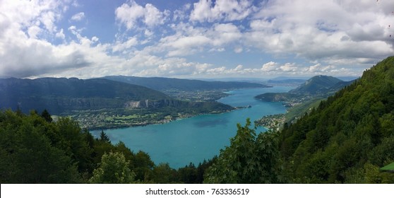 Annecy Rhône Alpes France

August 6 2017

Perfect Blue Lake Panorama with beautifull sky and forests.
Picture taken from "col de la forclaz" 
