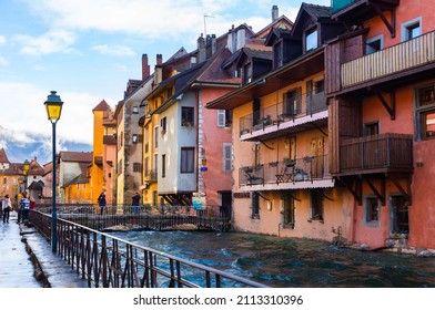ANNECY, FRANCE - DECEMBER 30, 2021: Picturesque Venice of Alps - small French town of Annecy with cobblestone streets and pastel houses along canals with Thiou river on winter..