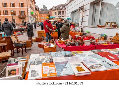 Annecy, France - January 29, 2022: People buying and selling at the old town market of Annecy, France.