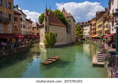ANNECY, FRANCE - Jul 24, 2020: The hotel Le Palais de L'ISle on a canal surrounded by buildings in Annecy, France
