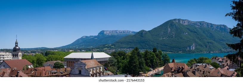 Annecy, France - July 2 2022: Panorama banner of the old town and the lake Lac d'Annecy.