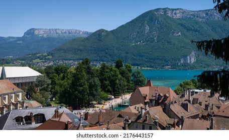 Annecy, France - July 2 2022: The old town and the lake Lac d'Annecy with its emerald green water.